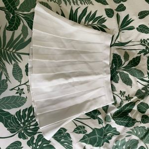 white tennis shirt with built in shorts